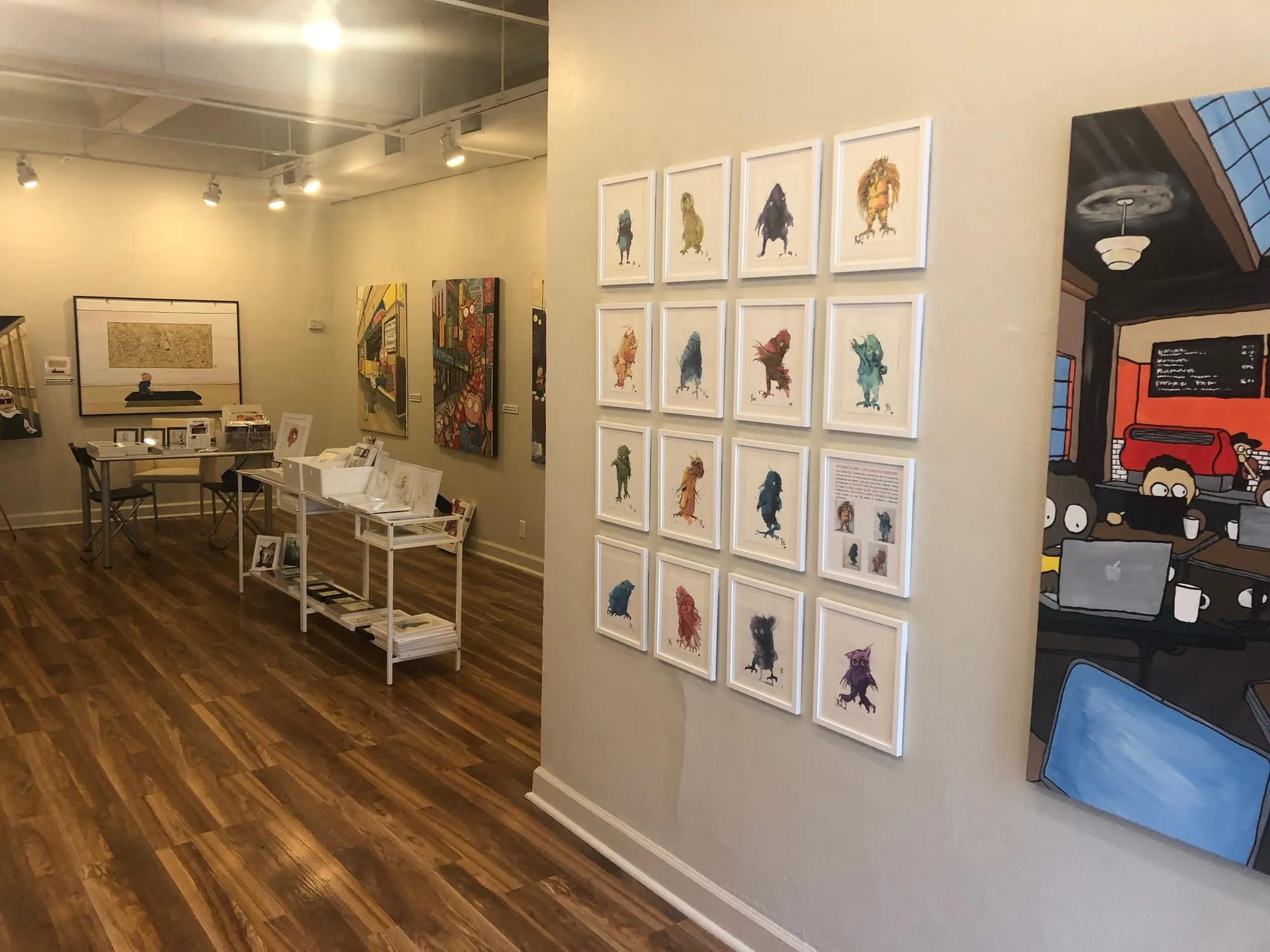 Framed watercolors on the gallery wall